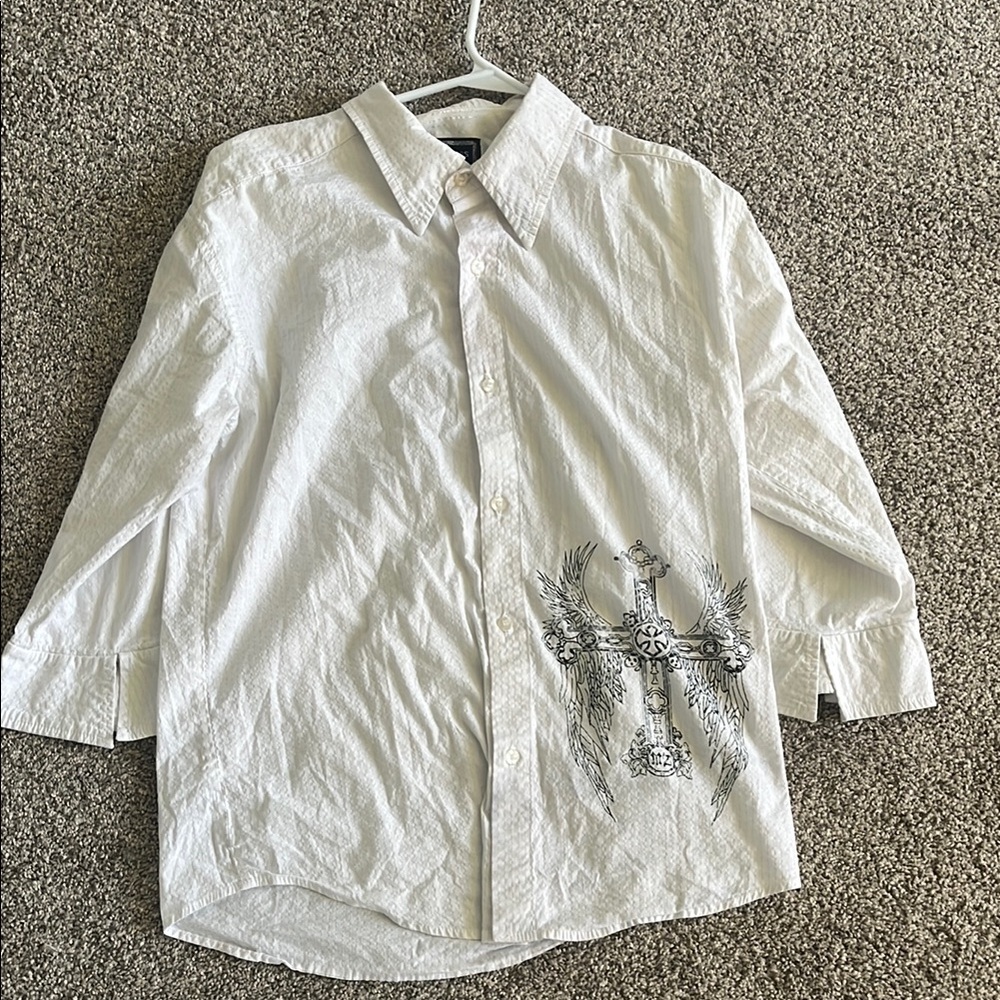 Women's button down with cross design and shiny stripes.